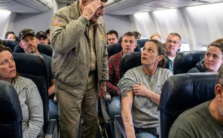The rich man in first class pointed at my stained hoodie and told the flight attendant to move me back where I belonged — but when a Marine General saw the faded tattoo I forgot to cover, he dropped his briefcase and saluted me with tears in his eyes. What did he see that turned the whole cabin silent?