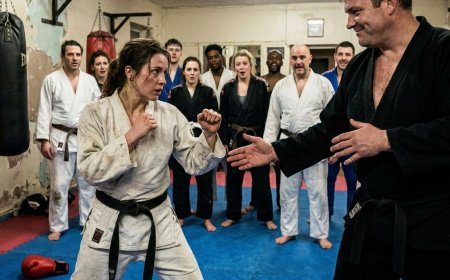 A 200-pound black belt used a 14-year-old girl for full-contact target practice while the instructor scrolled his phone — but when she dropped the focus mitts and squared her bare hands, the room went silent.